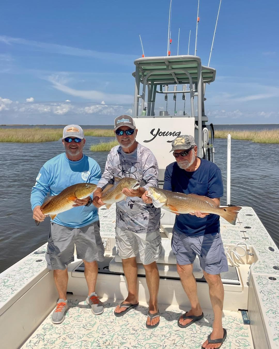 Crew with big redfish